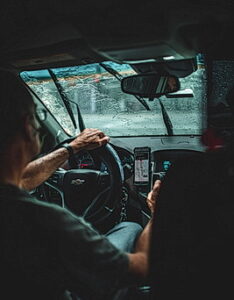 Man driving under poor weather conditions